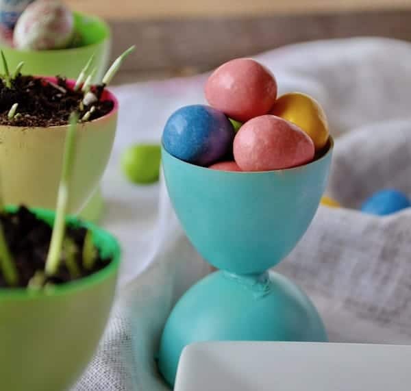 Easter egg cups made with plastic easter eggs.