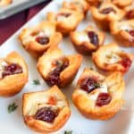 Close-up photo of a platter filled with brie bites.