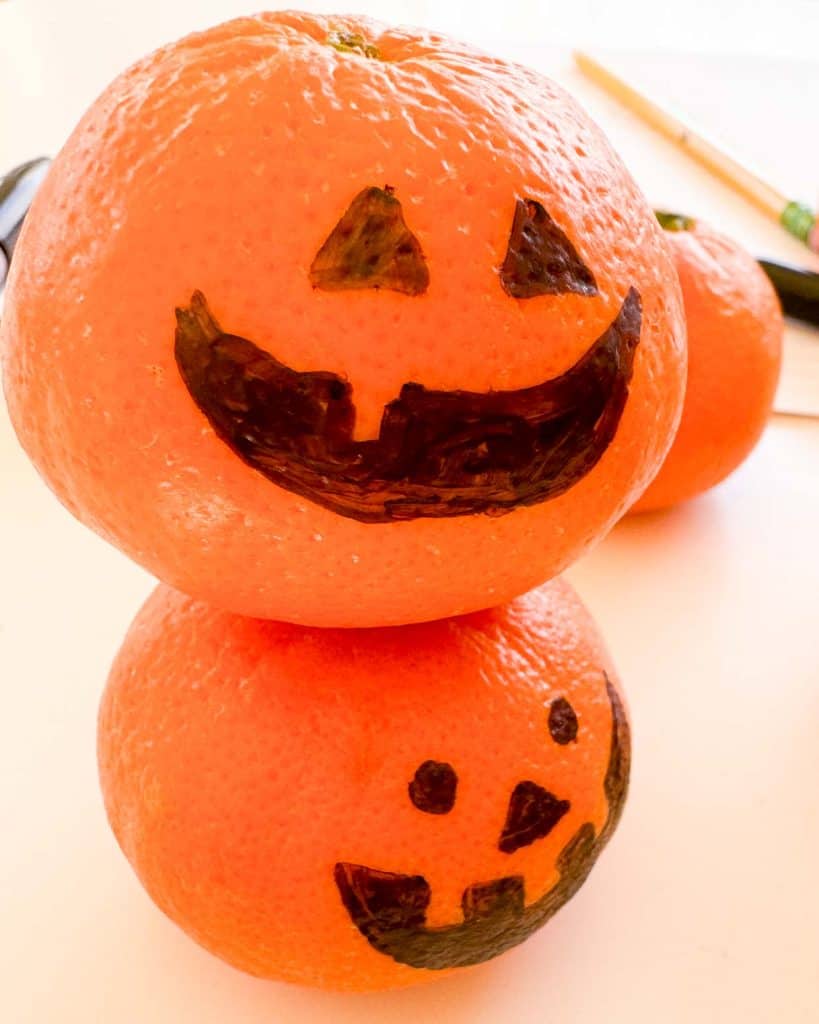 Clementine pumpkins, sharpies and a pencil.