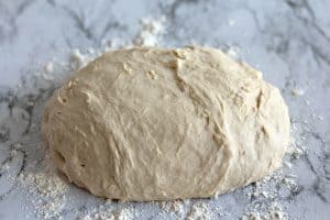 Dough on a floured surface.