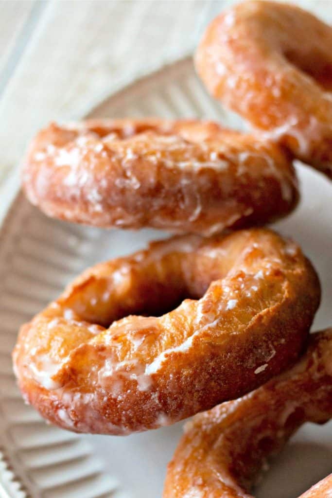 Glazed Amish Doughnuts on a white plate.