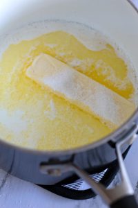 Sugar, milk, and melted butter in a pot.