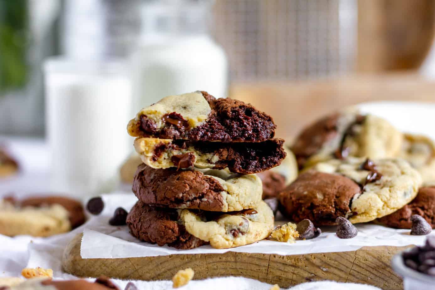 A stack of chocolate chip cookies on a cutting board, perfect for winter desserts.