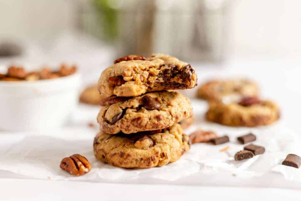 Cookies stacked on a wood tray.