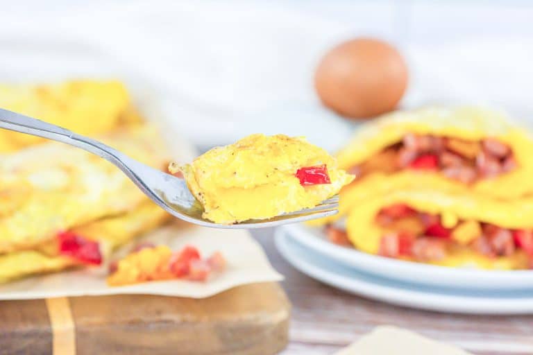 A bit of Denver omelet in a fork.