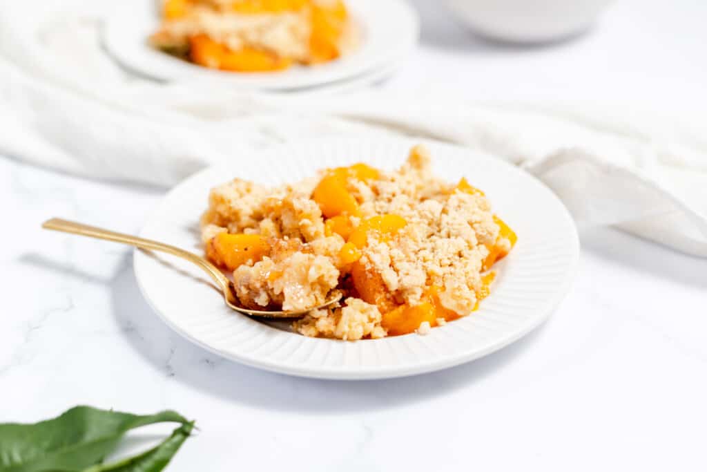 A plate of peach crumble. 