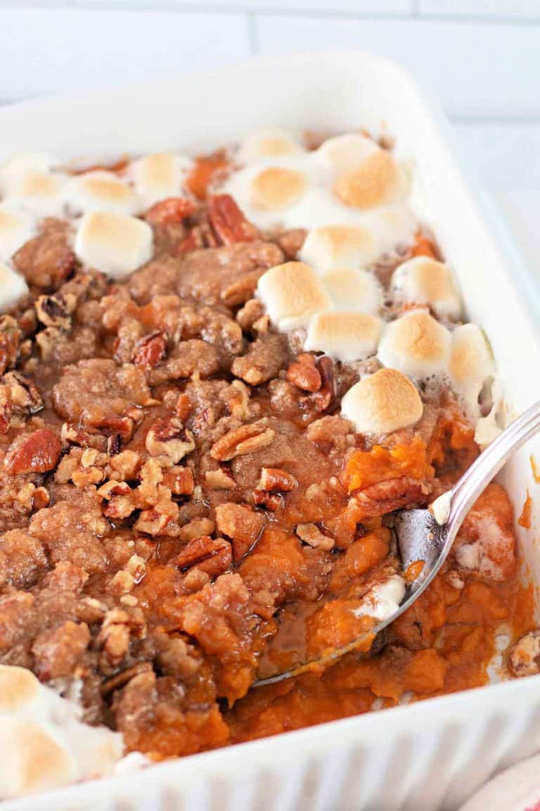 Sweet potato casserole topped with pecan streusel and toasted marshmallows around the edges.