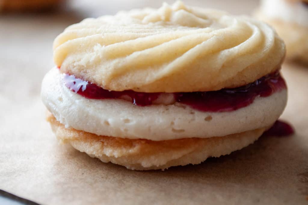 Viennese whirl cookies with buttercream and raspberry jam filling.