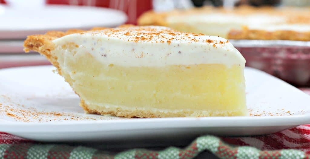 Slice of pie with a white layer on top. 