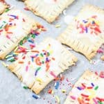 Mini homemade Pop-Tarts with icing and sprinkles.