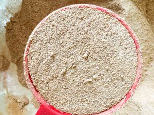 Hot cocoa mix in a measuring cup.