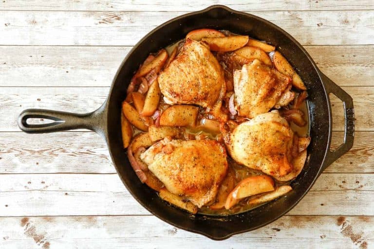 Apple cider chicken in a skillet.