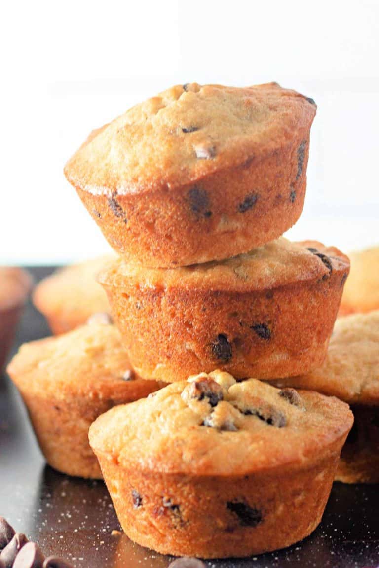 A stack of muffins with chocolate chips, golden and baked to perfection.