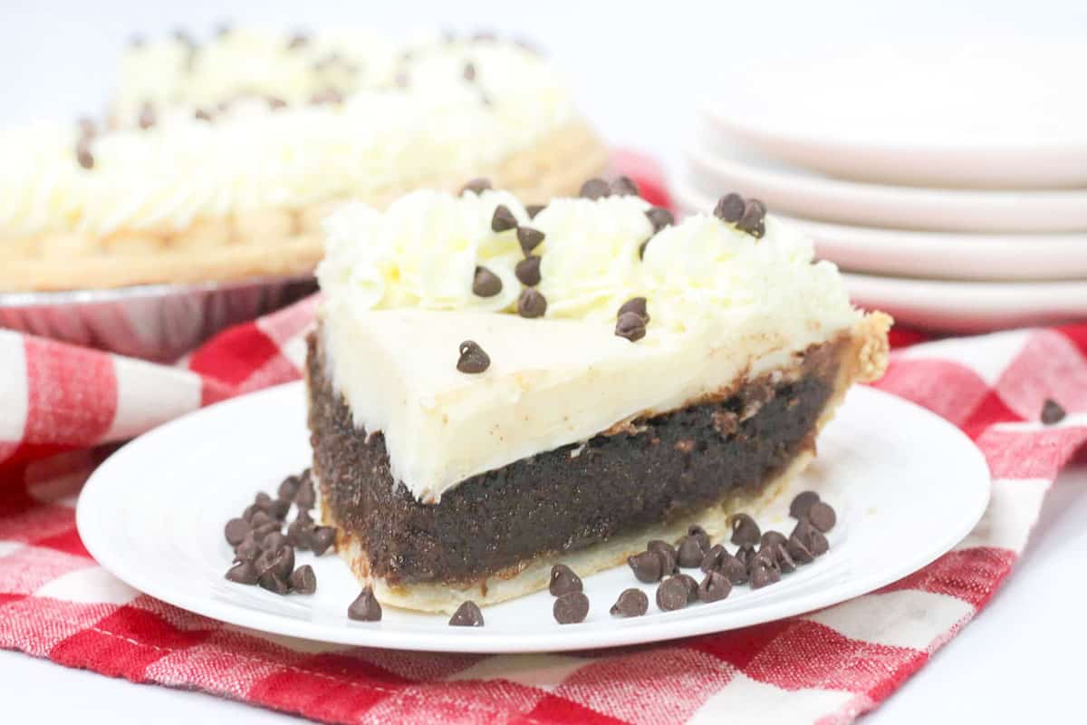 Granny's chocolate pie slice with whipped cream and chocolate chips.