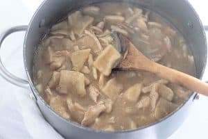 Chopped chicken added to the pot.