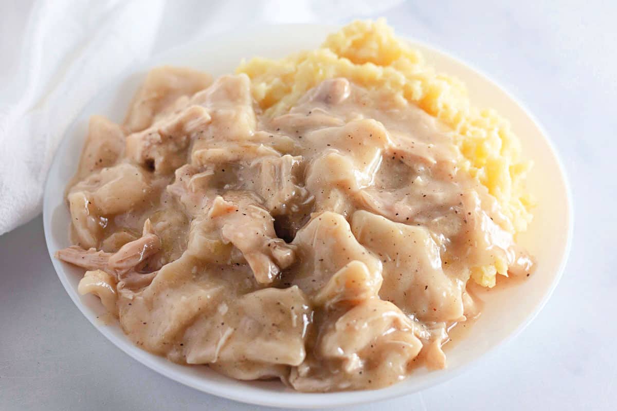 Chicken and dumplings served with mashed potatoes.