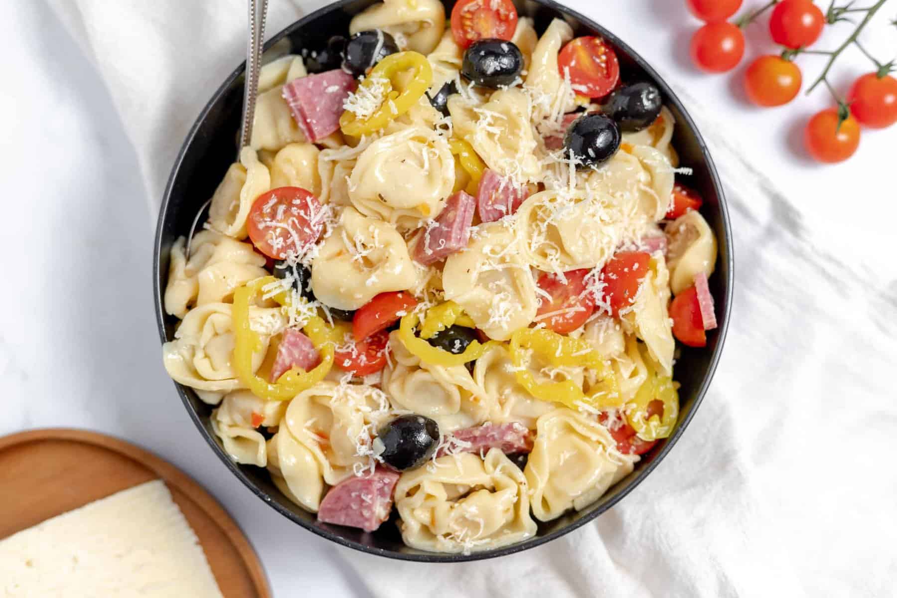 A bowl of tortellini salad.