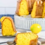 Two cake slices on silver plates.