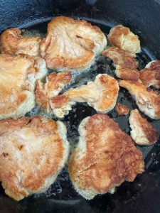 Browned mushroom slices in the skillet