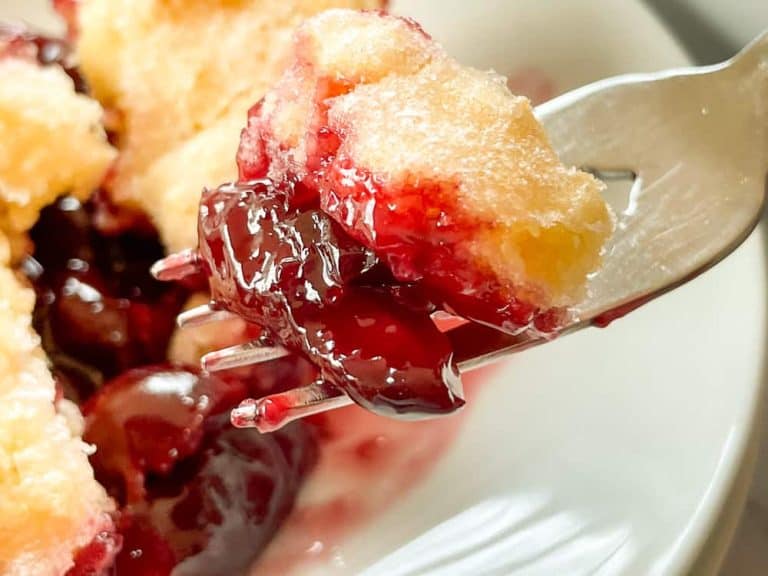 A forkful of sweet cherry cobbler.