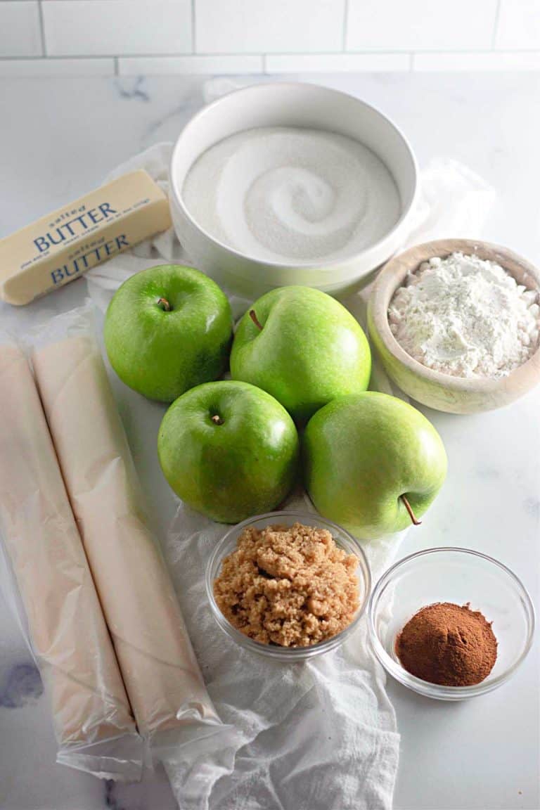 Ingredients for apple galette, including Granny Smith apples, sugar, butter, flour, and cinnamon.