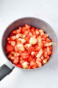 Chopped strawberries and apples in a saucepan for Easy Strawberry Jam.