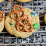 M&M's pretzel cookies are cooling on a wire rack.