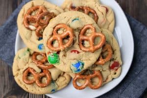 Close-up of an M&M's pretzel cookie with golden edges.