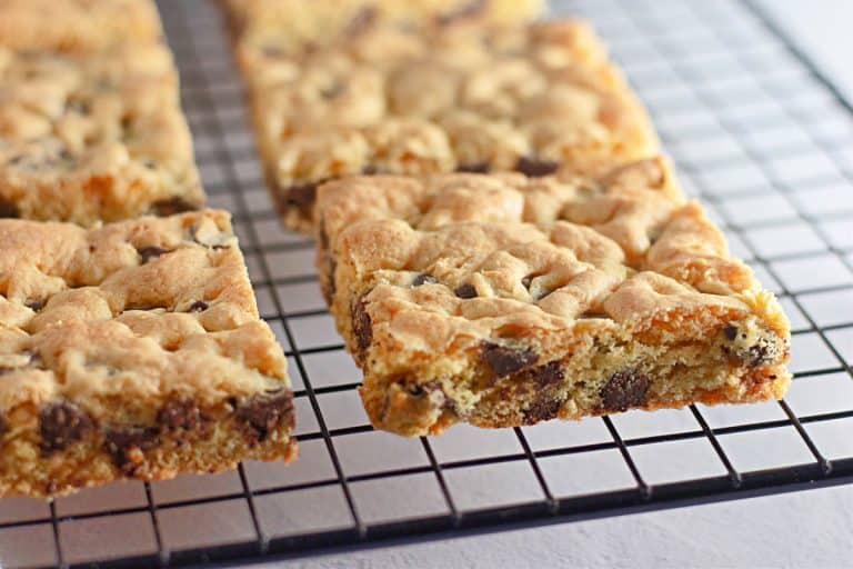 Close-up of cookie bars cooling on a wire rack.