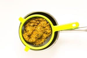 Cooked petals in a strainer over the pot.