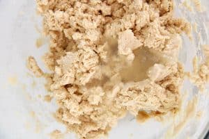 Close-up of lemonade concentrate poured into the dough.