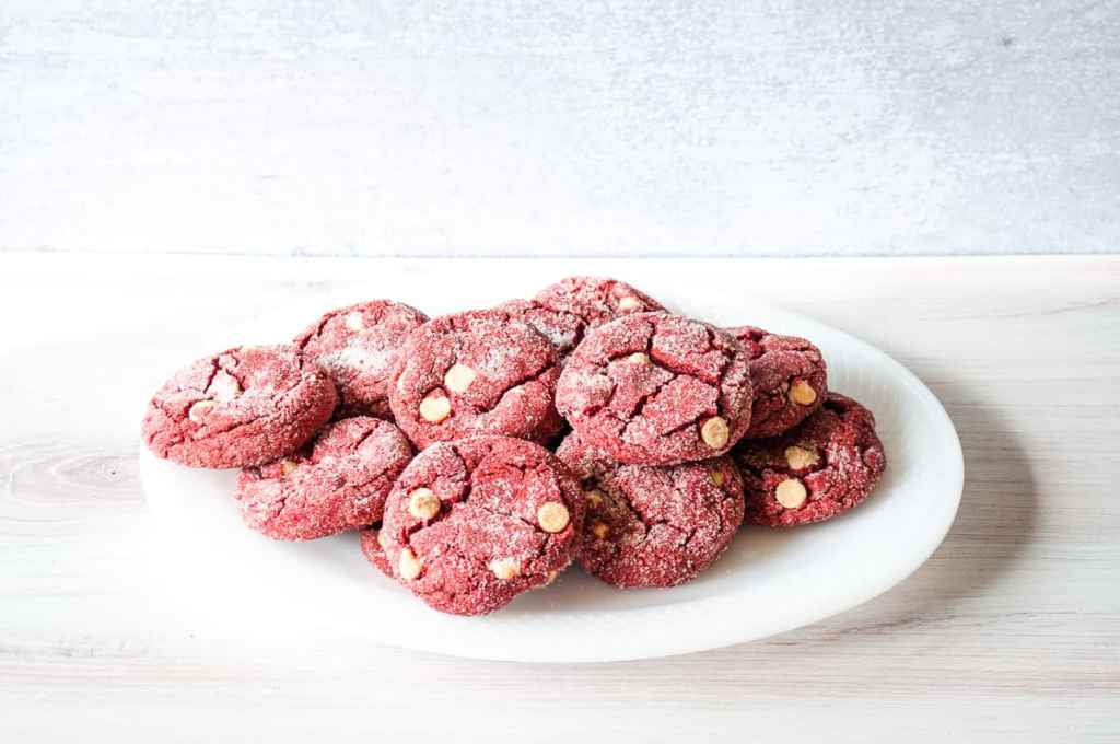 Red velvet cookies rolled in sugar.