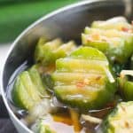 A bowl of pickled cucumbers.