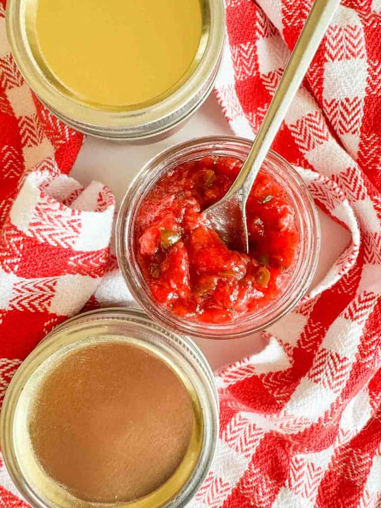 Close-up of the open jar with a spoon inside.