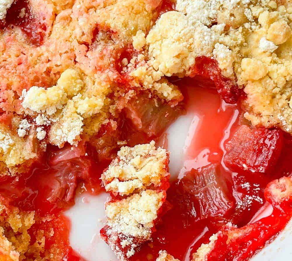 Rhubarb and cake mix in a dessert pan.