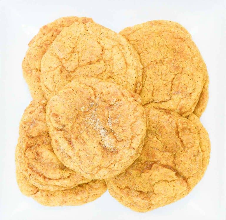 Close-up of pumpkin snickerdoodles on a white plate.
