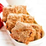 Bright close-up of sugar-coated apple cider blondies in a dish.