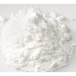 Pile of baking powder on a white background.