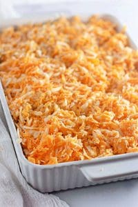 Close-up of shredded cheese covering macaroni.
