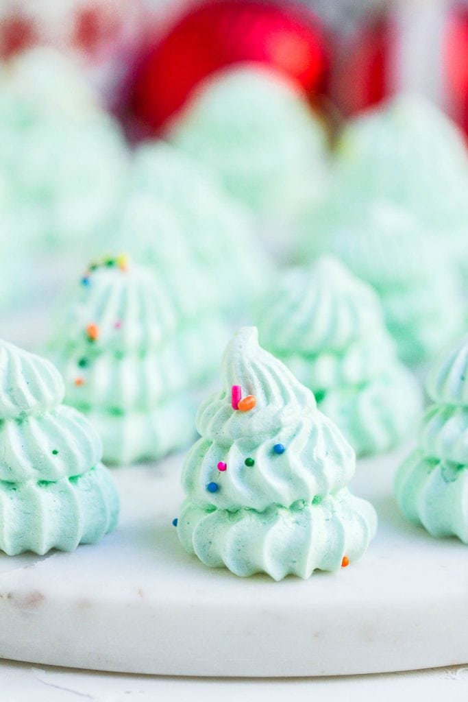 Close-up of a single meringue tree with colorful sprinkles.