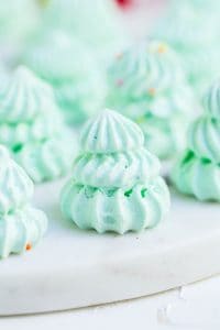 Close-up of a single meringue shaped like a small Christmas tree.