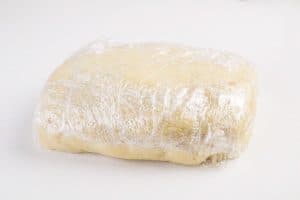 Cookie dough wrapped in plastic wrap.