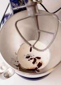 Cream and vanilla in a mixer bowl for frosting.