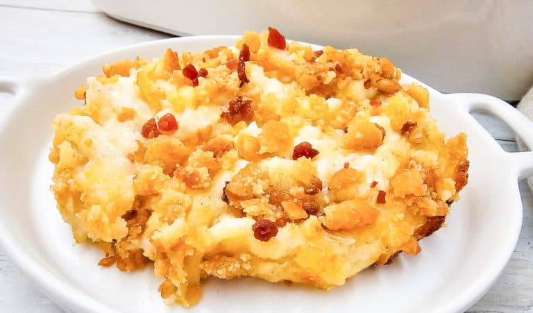 Single serving of pepper jack potato casserole with golden crust.