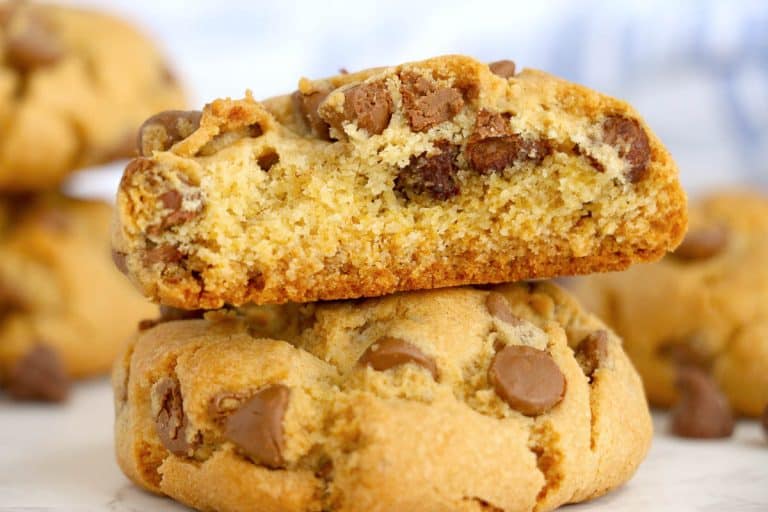 Cookie broken in half showing soft, gooey center.