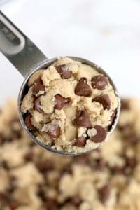 Cookie dough scooped with chocolate chips visible.