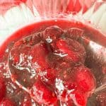 A spoonful of thick brown sugar cranberry sauce.