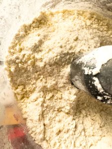 Flour mixture with small butter pieces after pulsing in a food processor.