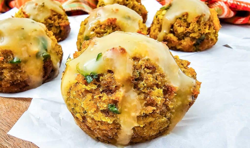 Close-up of a crispy stuffing muffin showing its texture and gravy topping.