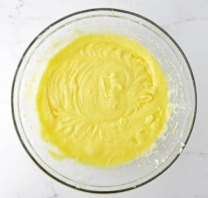 Smooth yellow cake batter after mixing in wet ingredients.